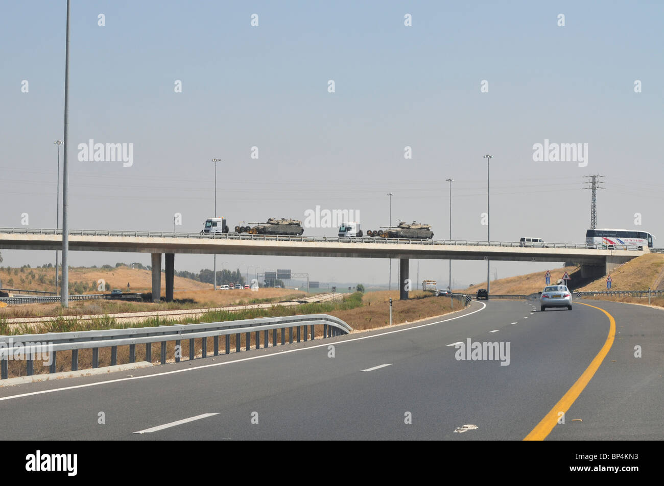 Israel, Tank carriers transporting Merkava tanks on a highway Stock Photo