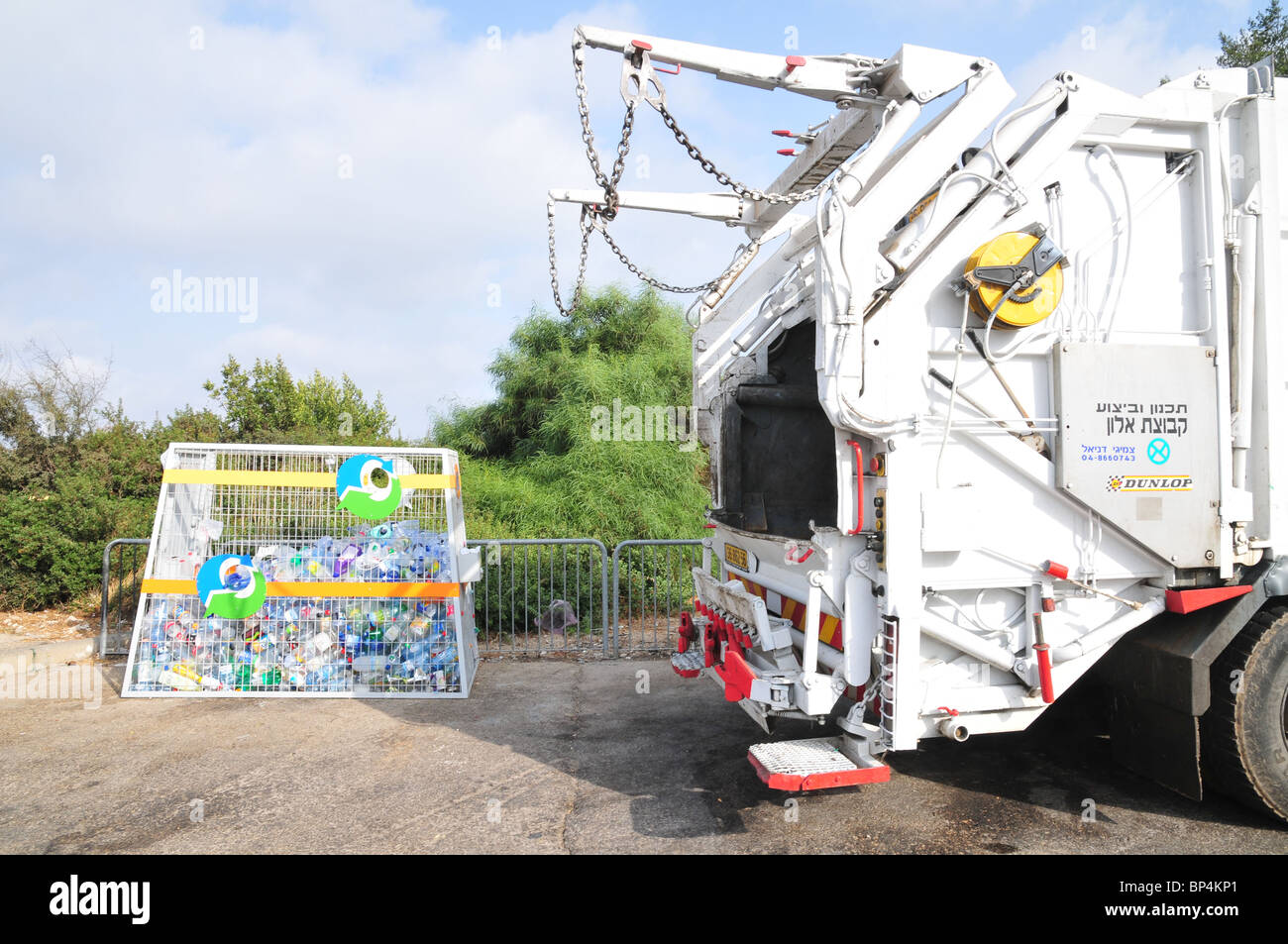 Truck collects plastic bottles for recycling Stock Photo Alamy