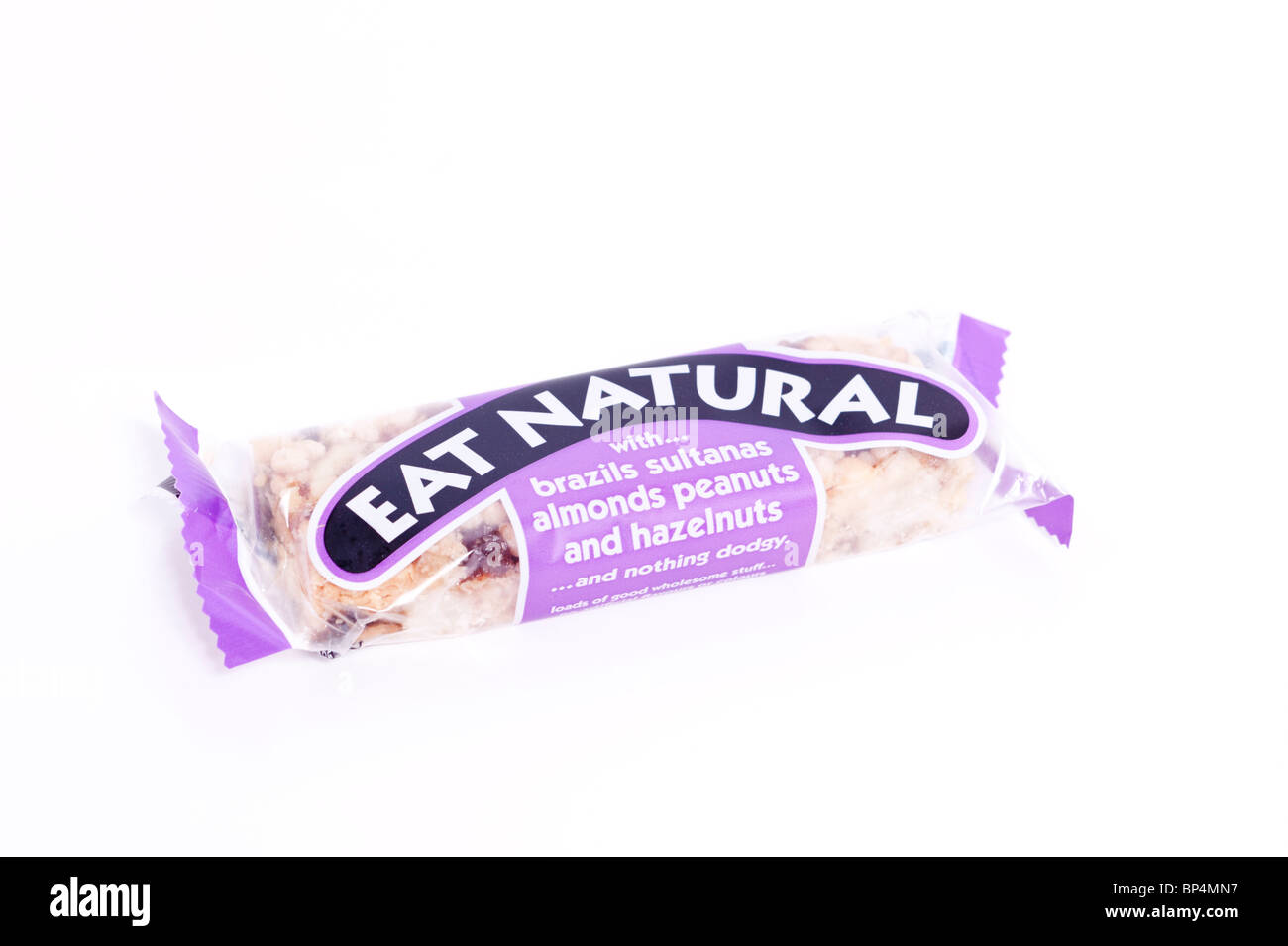 A cut out of an Eat Natural wholesome bar with various nuts on a white background Stock Photo