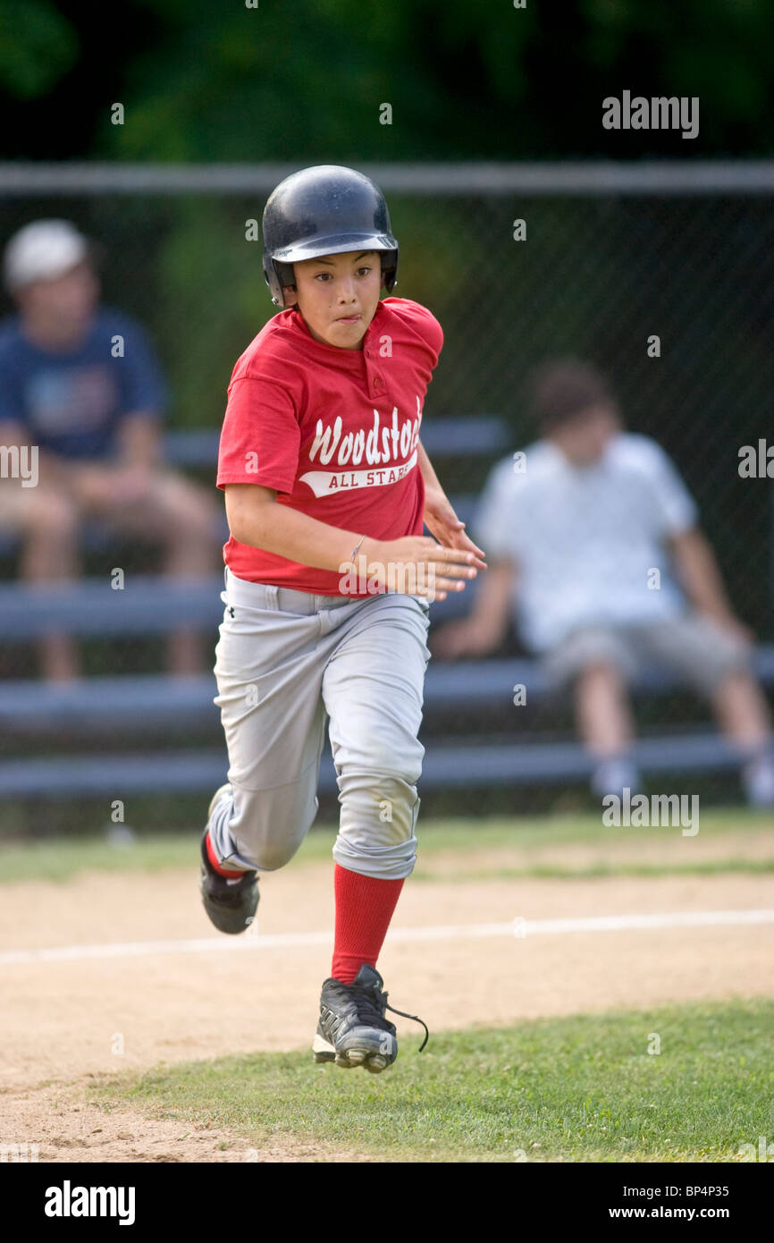 Boys baseball game action Stock Photo Alamy