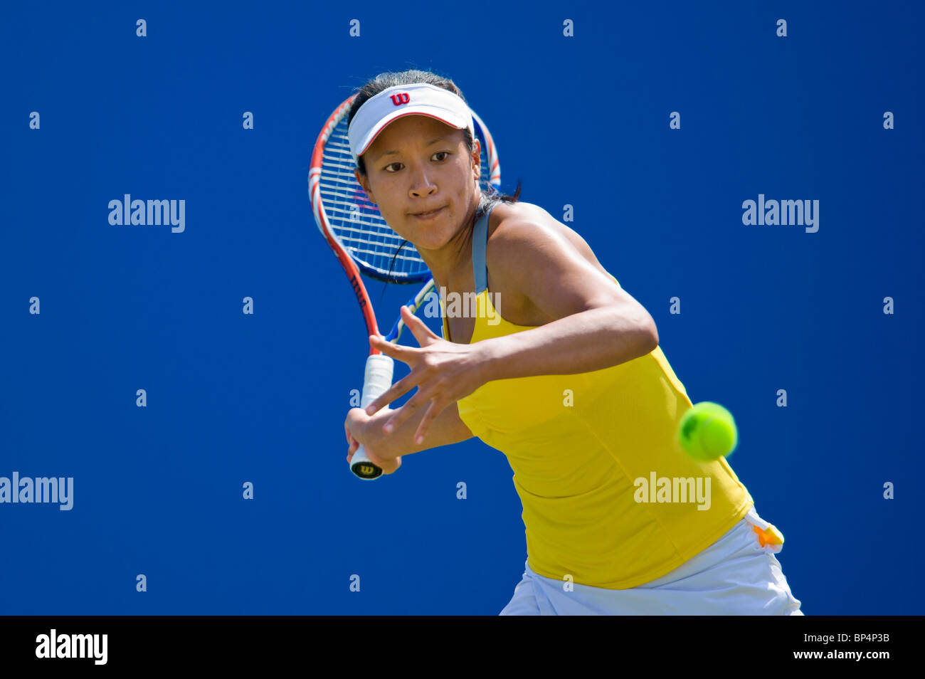 Anne Keothavong of Great Britain in action against Daniela Hantuchova of Slovakia. Stock Photo