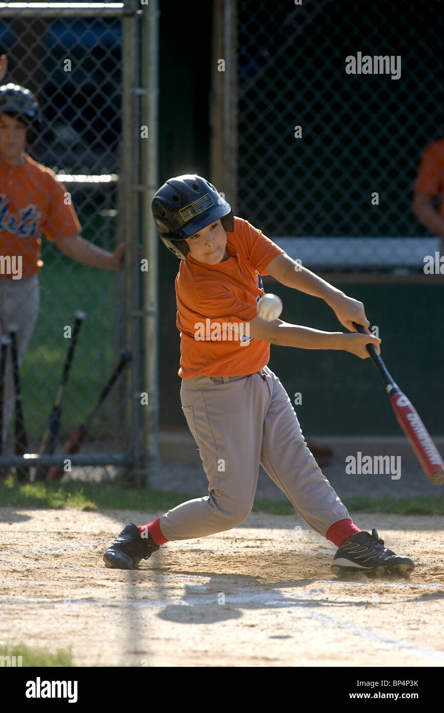 Boys baseball game action Stock Photo Alamy