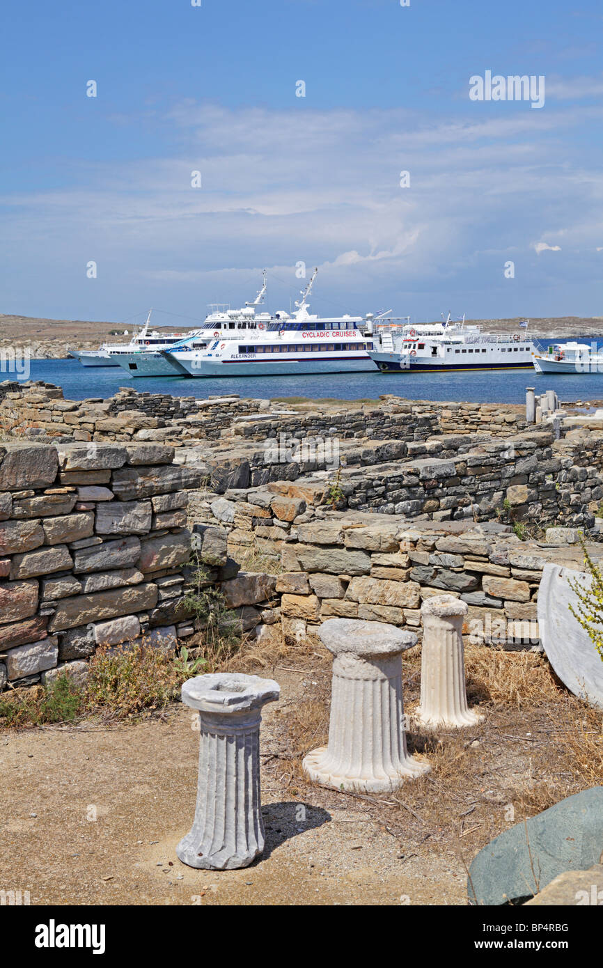 excursion boats at the harbour of the archaeological excavation, island of Delos, Cyclades, Aegean Islands, Greece Stock Photo