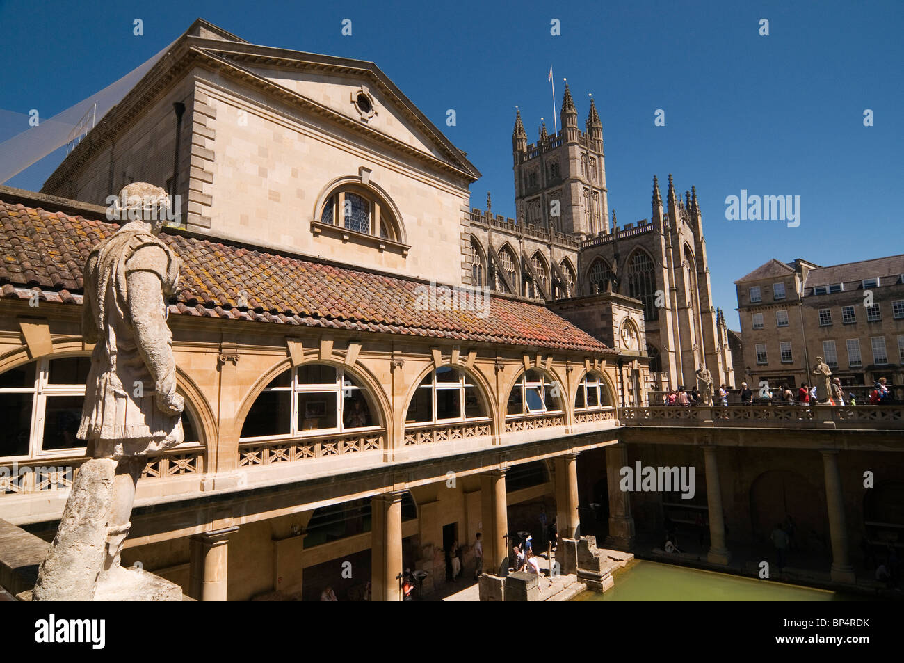Roman Statue overlooking Baths and Abbey at Bath Somerset England UK Stock Photo