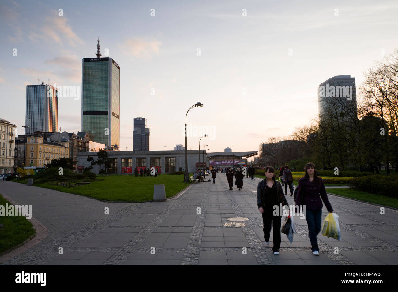 People walking from 'Warsaw Central Rail Station' on 'Parade Square' (Plac Defilad), Warsaw Poland. Stock Photo
