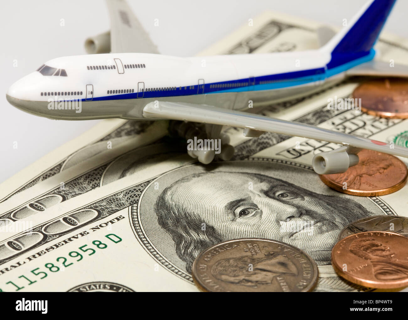 Toy airplane on American dollar Stock Photo Alamy