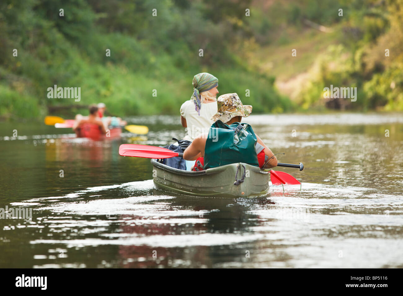 People boating on river Stock Photo