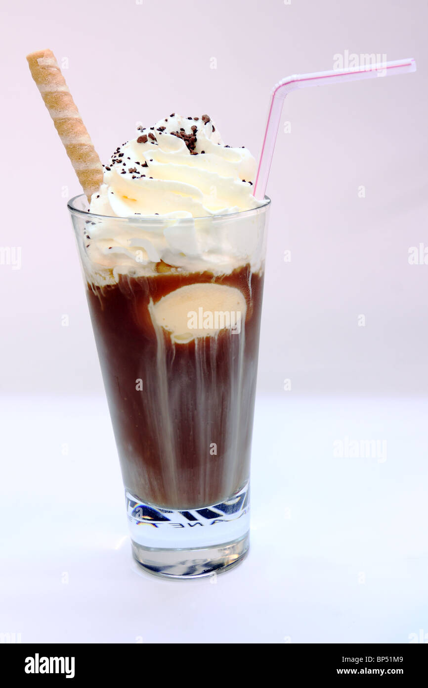 Iced coffee in tall glass. One sweet cold latte with whipped cream, with  chemex coffee maker on dark brown background copy space Stock Photo - Alamy