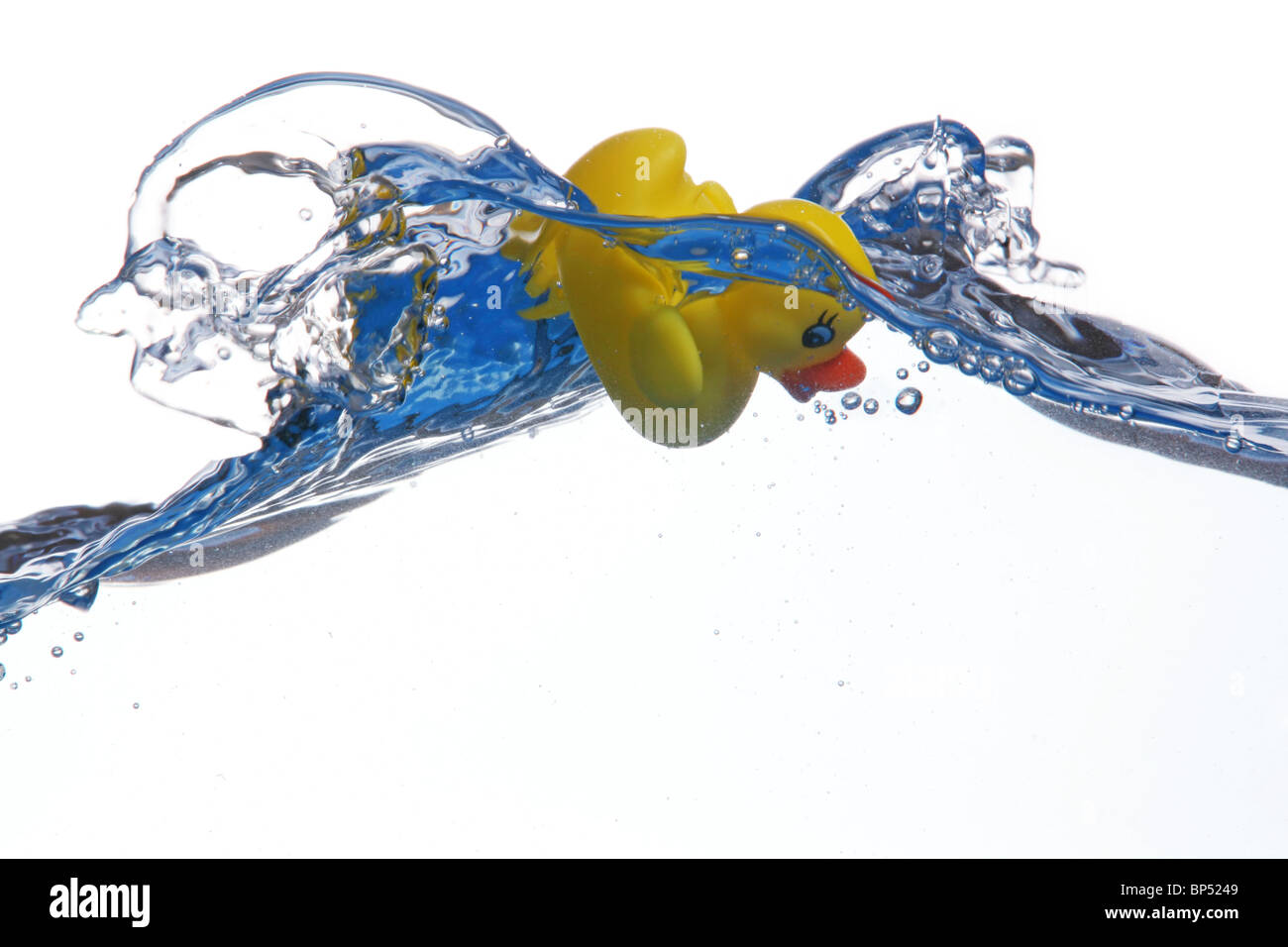 plastic duck swimming with big wave Stock Photo