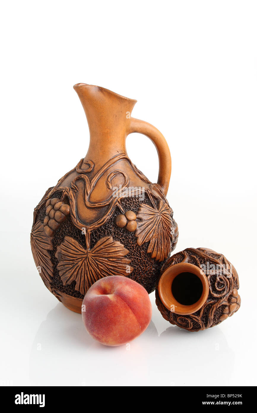 Wine jar and fruit on white background Stock Photo