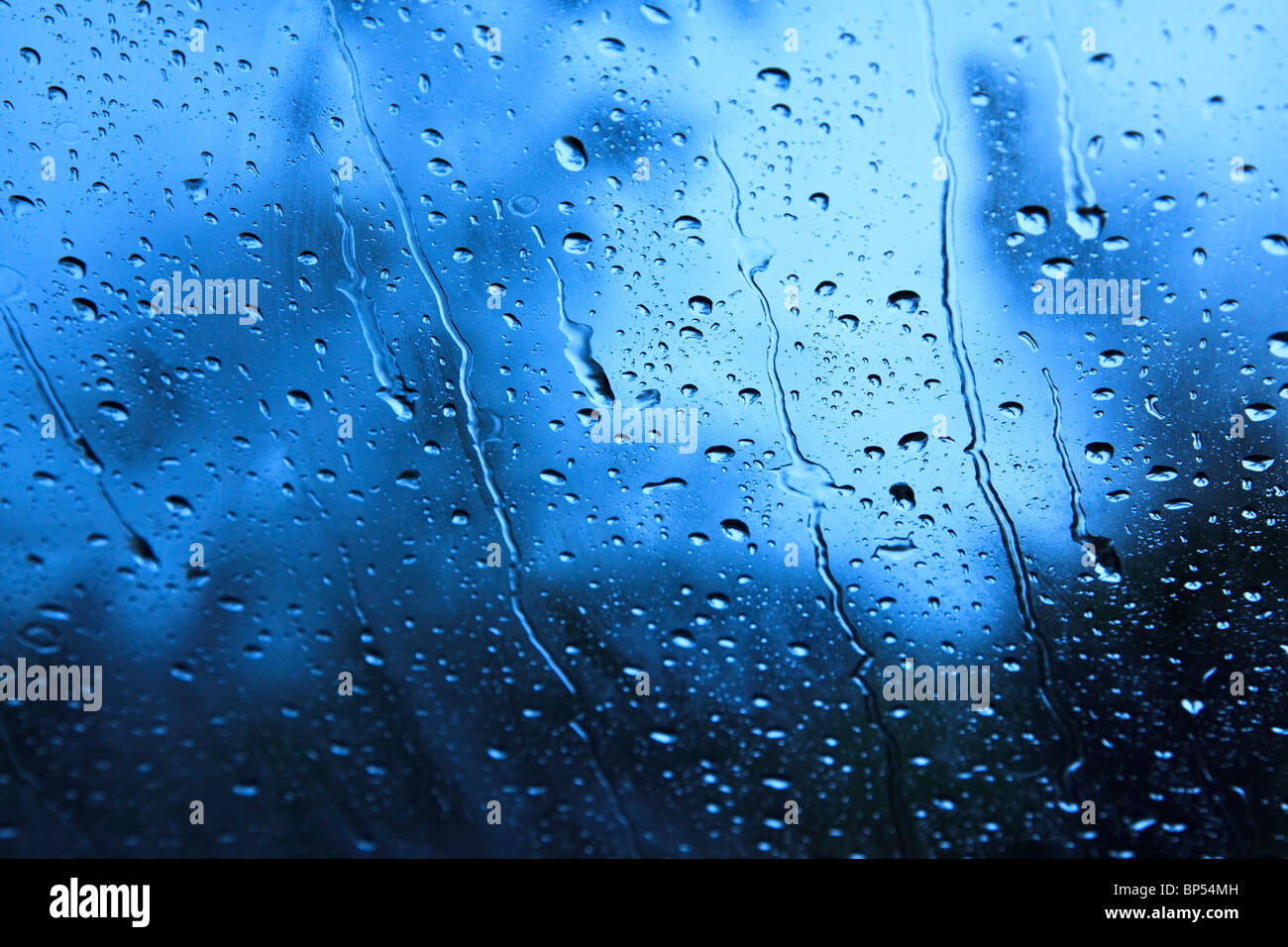 Rain dripping and dribbling down a window Stock Photo Alamy