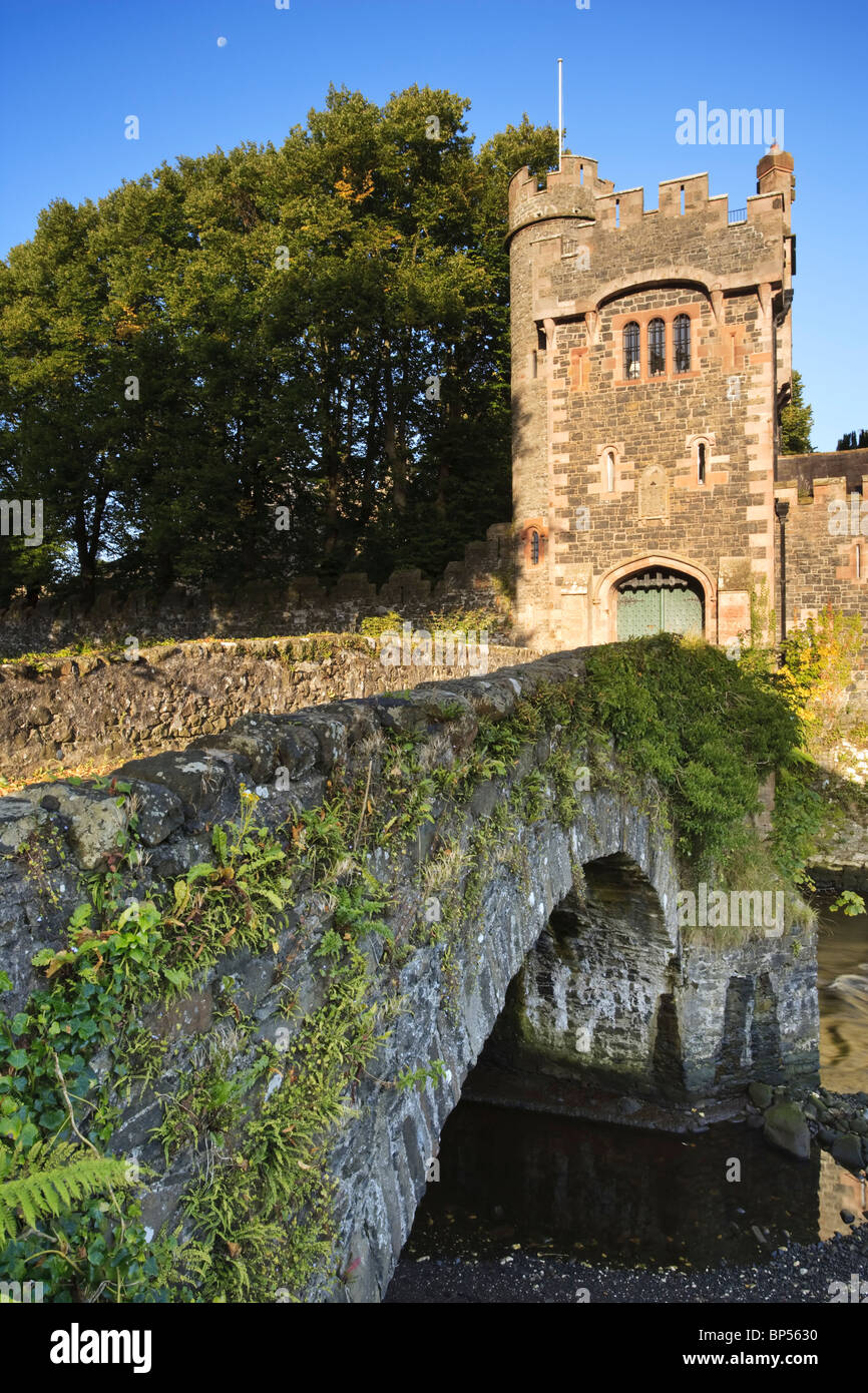 Bridge over Glenarm River leading to a tower-gate in the grounds of Glenarm Castle, County Antrim, Northern Ireland Stock Photo