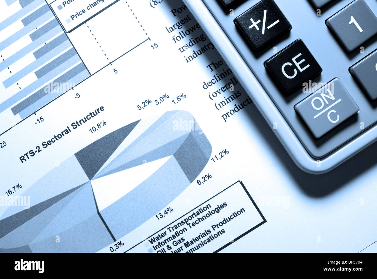 Calculator and printed stock data with diagrams. Stock Photo