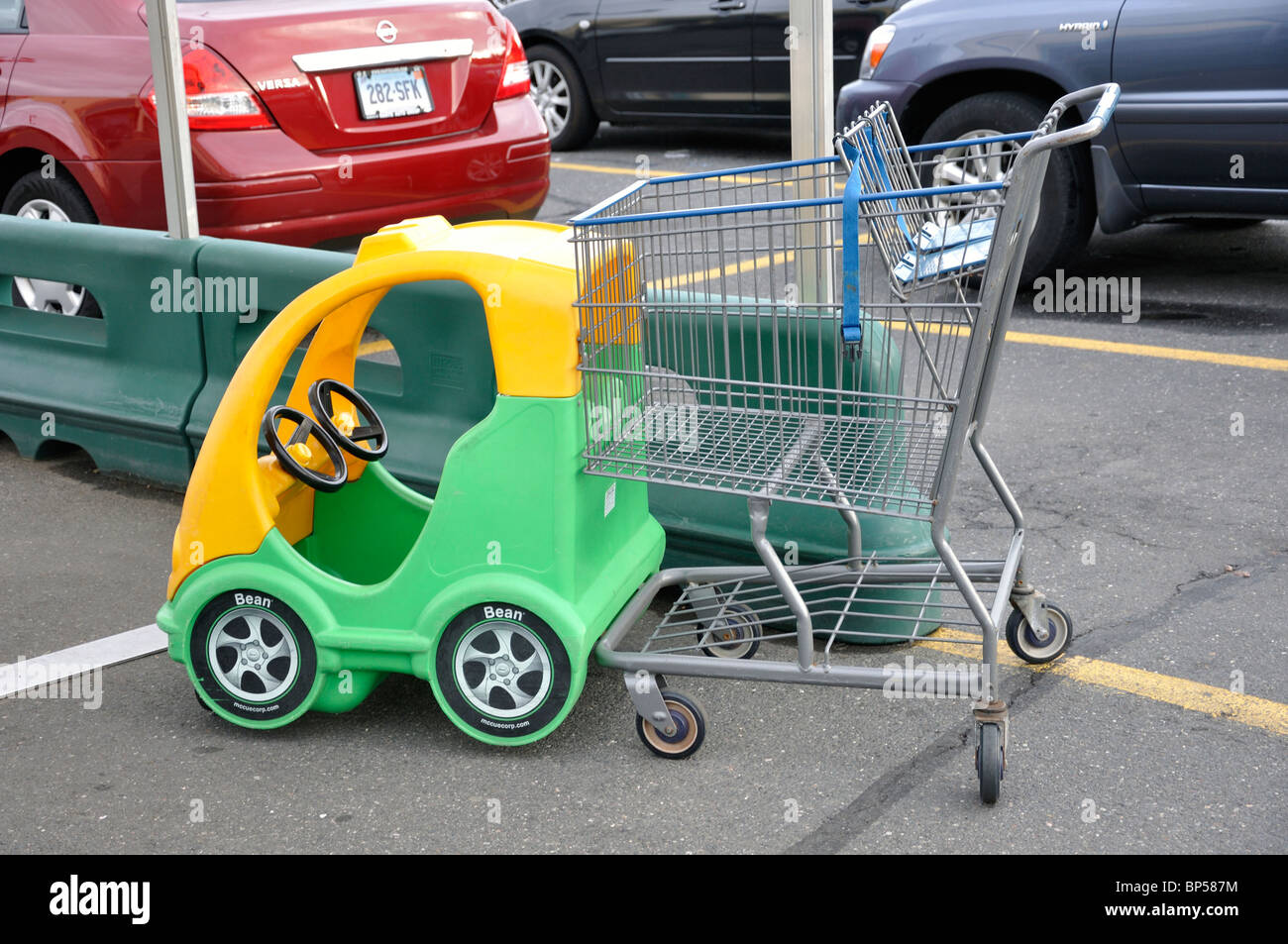 Car shaped shopping cart with compartment for children Stock Photo Alamy