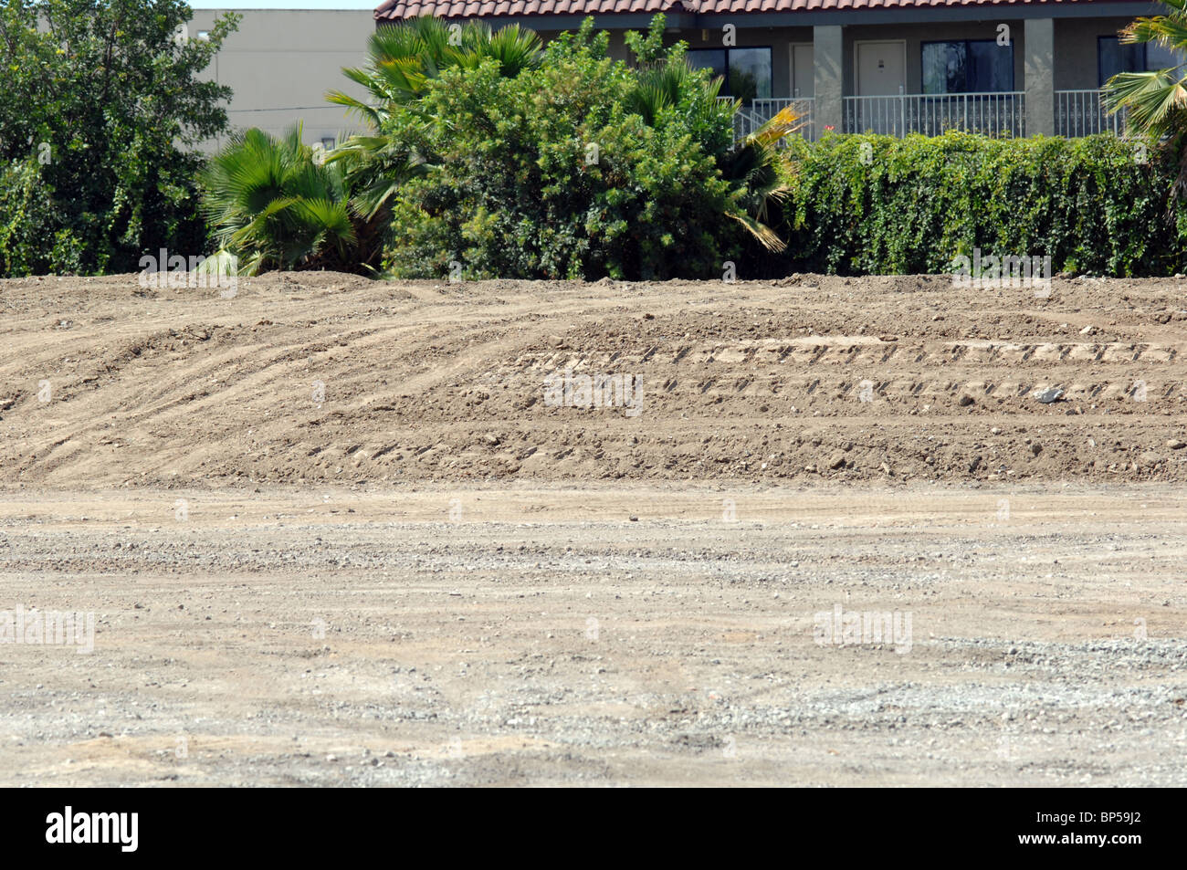 Bulldozer track marks on landscaped area. Stock Photo