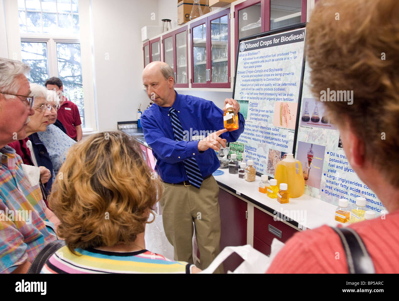A scientist explains biodiesel  fuels made from grains at the CT Agricultural Center in New Haven CT USA Stock Photo