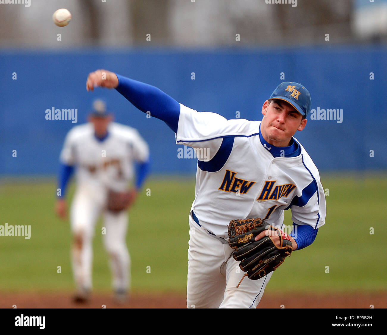 A College baseball pitchers delivers during a game in New Haven CT USA. University of New Haven. Stock Photo