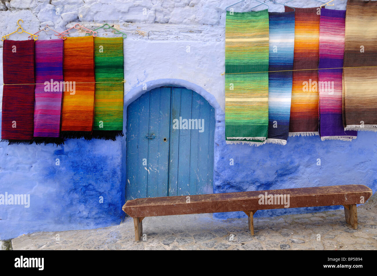 Display Of Colourful Woven Carpets Hanging Carpets Or Rugs For