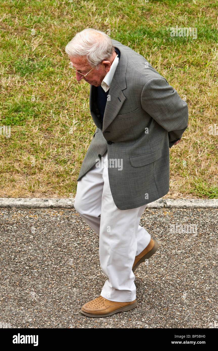 Old man walking bent hires stock photography and images Alamy