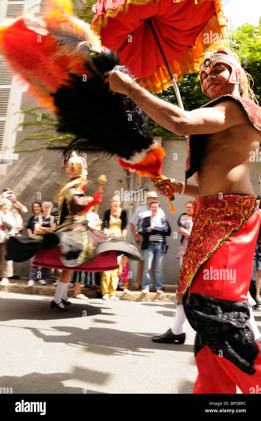 A male Brazilian dancer in a street parade with a female dancer behind at the 53rd Festival de Confolens 2010 Stock Photo