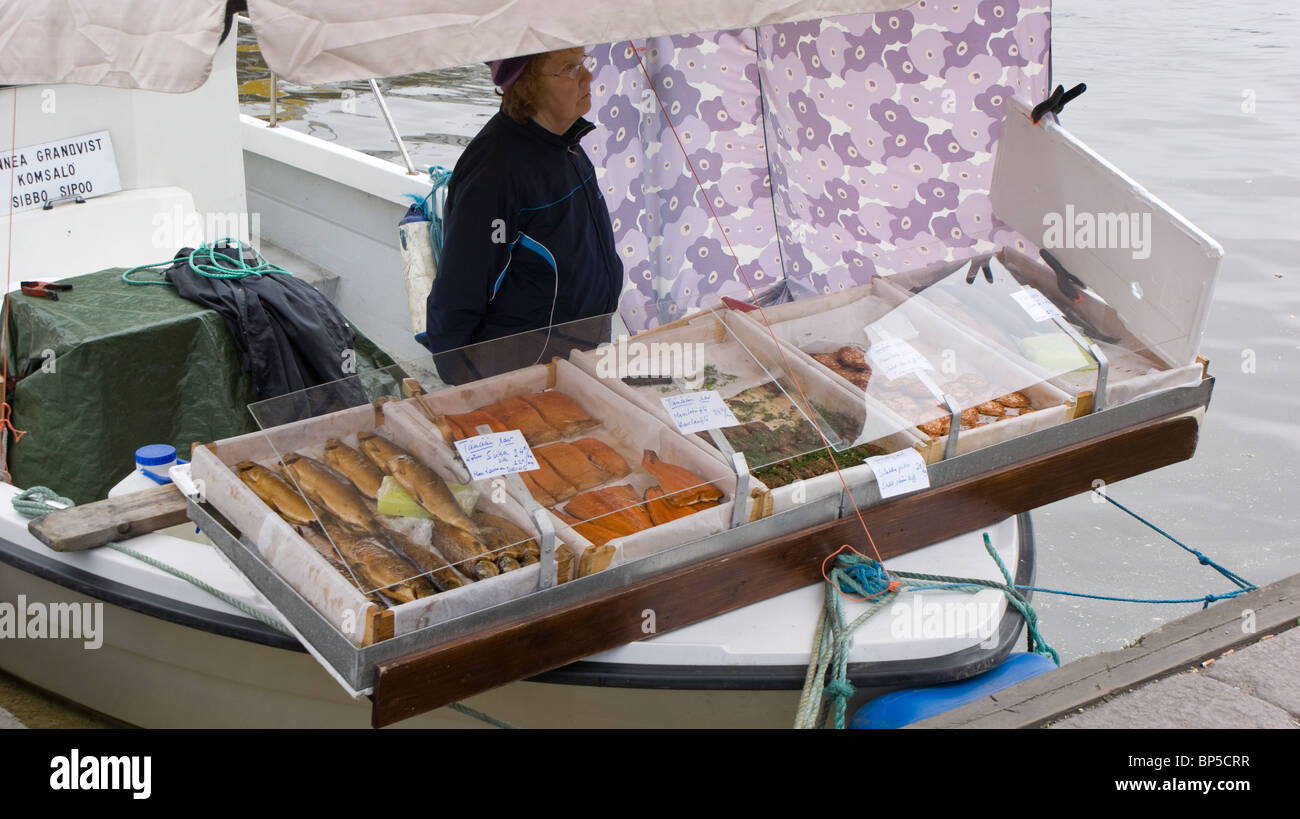 Fresh fish being sold from a small boat in Kauppatori quayside market Helsinki Finland Stock Photo