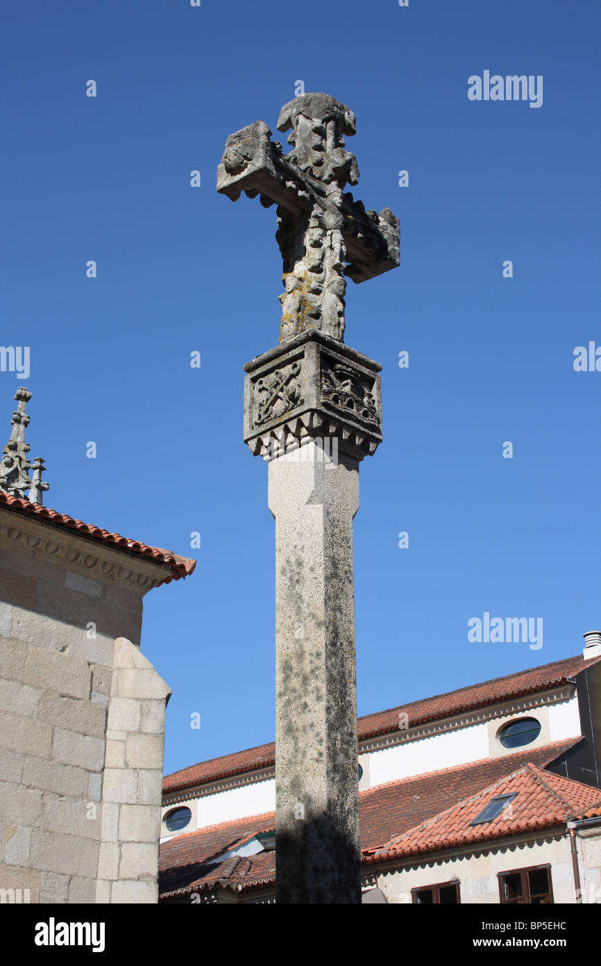 Ornately carved stone galician cross next to the Basilica de Santa Maria, Pontevedra, Galicia, Spain Stock Photo