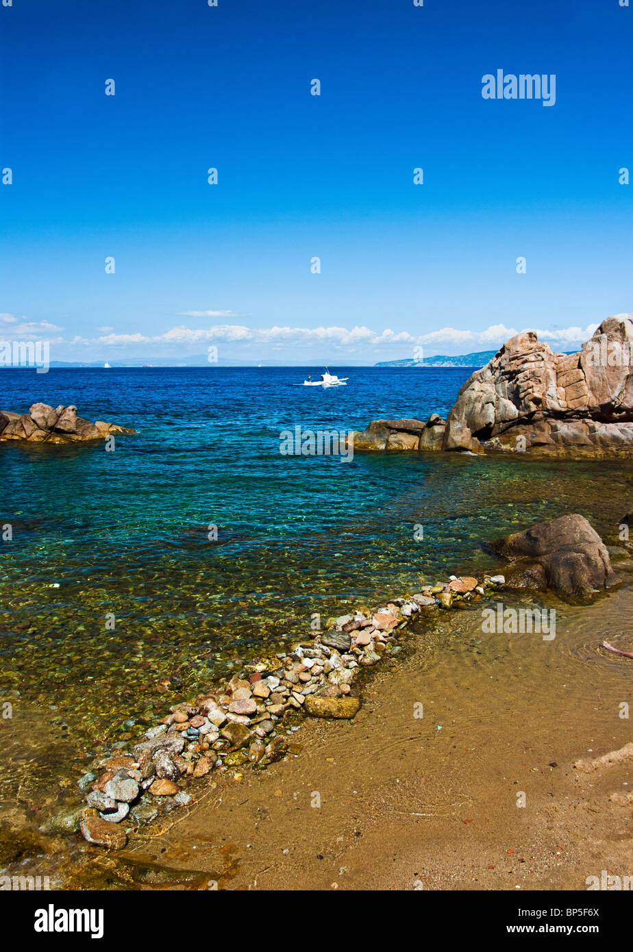 Bay of saracen  isle Giglio   tuscan arcipelago resumed in the afternoon hours in longitudinal. Isola del Giglio Cala saracino Stock Photo