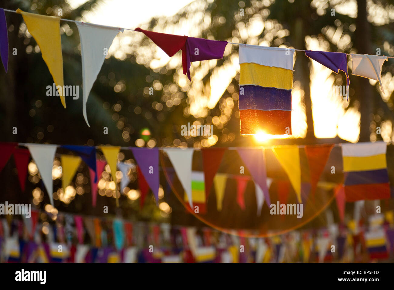 Prayer flags at sunset in a Cambodian wat - Kandal Province, Cambodia Stock Photo