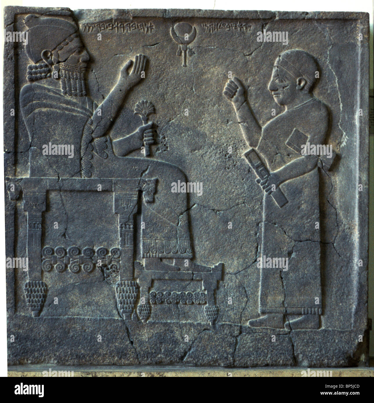 ORTHOSTAT RELIEF OF KING BARREKUB FROM ZINJIRLI DATING FROM C. 750 BC. THE KING IS SEATED ON A SPLENDIDLY DECORATED THRONE A Stock Photo