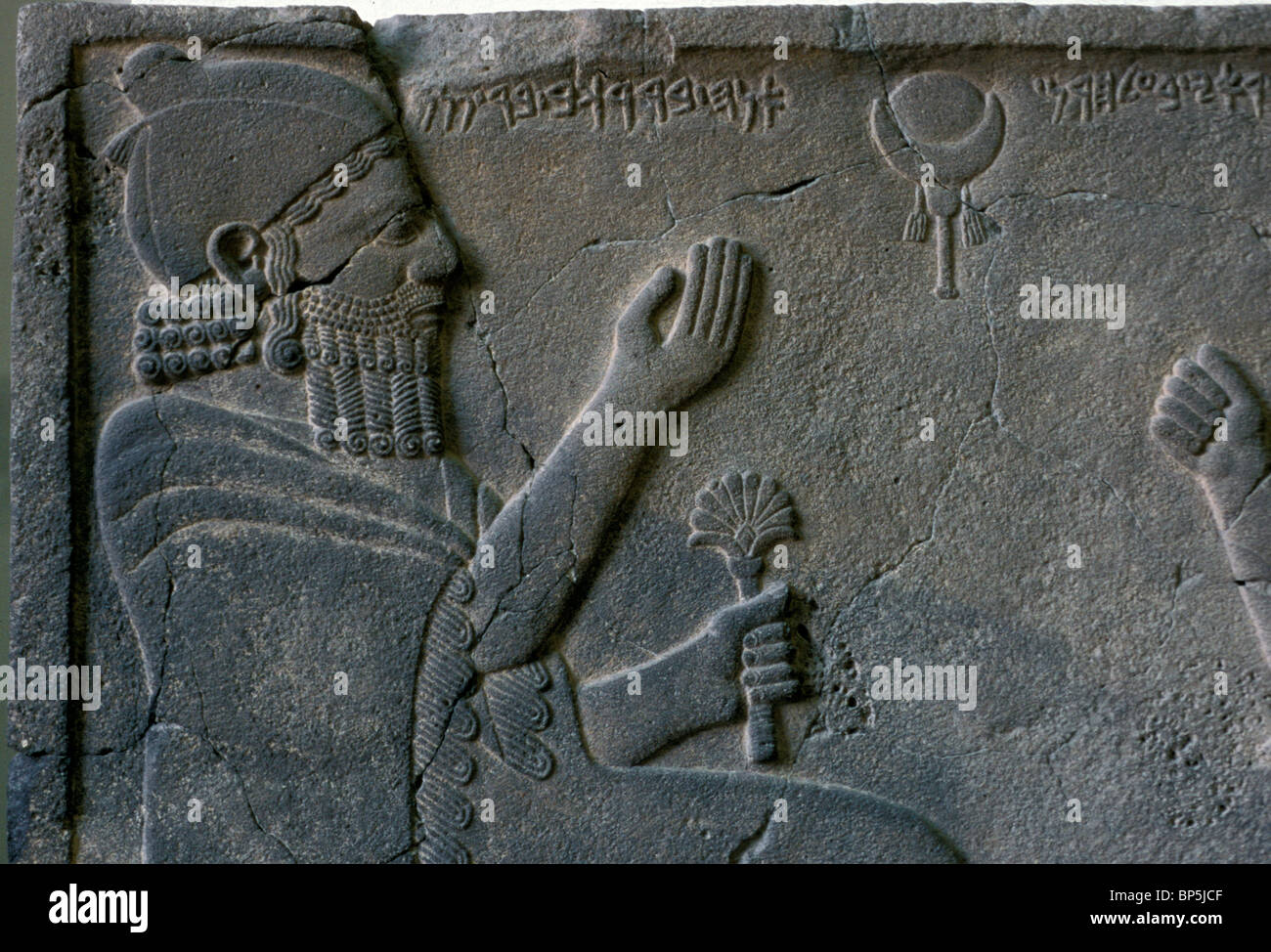 ORTHOSTAT RELIEF OF KING BARREKUB FROM ZINJIRLI DATING FROM C. 750 BC. THE KING IS SEATED ON A SPLENDIDLY DECORATED THRONE A Stock Photo