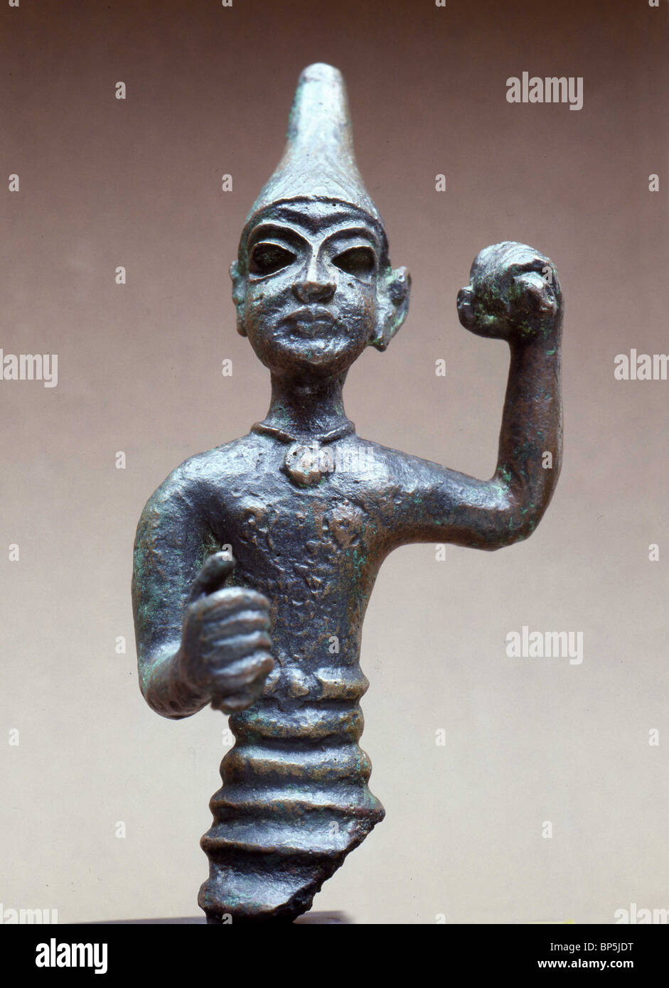 3787. BRONZE FIGURINE OF OF MALE DEITY, PROBABLY THE CNAANITE GOD OF WAR BAAL, DATING CA. 1400 - 1300 B.C. Stock Photo