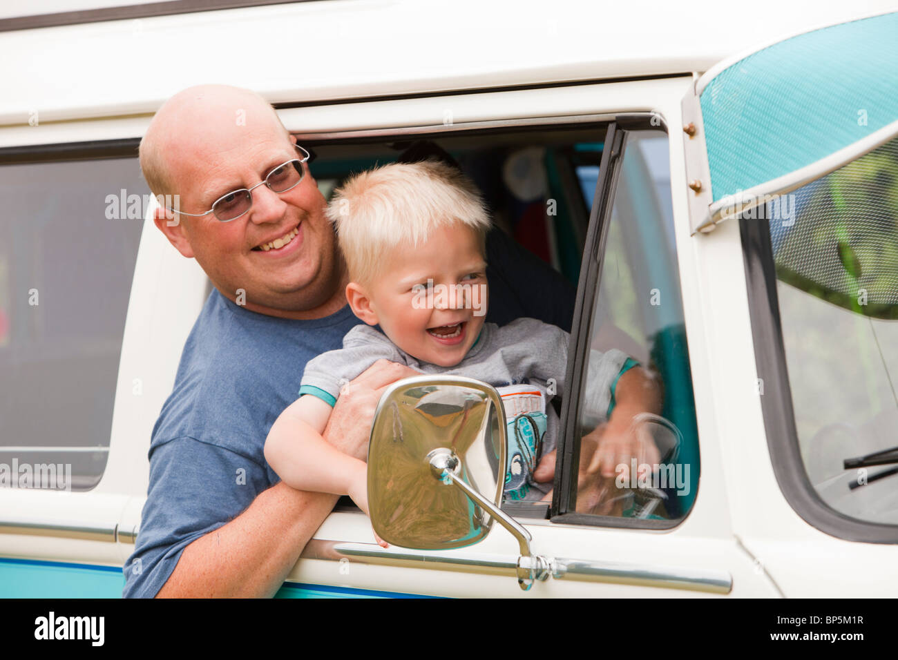 Fathers And Sons VW >> A Father And Son In An Old Restored Vw Camper Van Stock Fathers And Sons VW >> A Father And Son In An Old Restored Vw Camper Van Stock