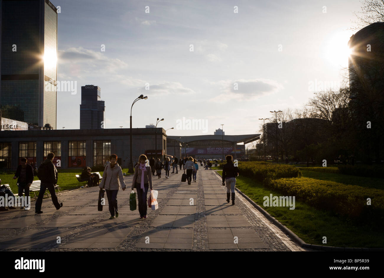 People walking on Parade Square (Plac Defilad), next to The Palace of Culture and Science, Warsaw Poland Stock Photo