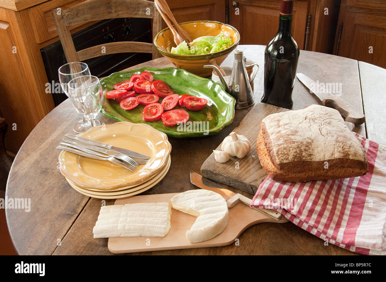 Table in french country kitchen Stock Photo - Alamy