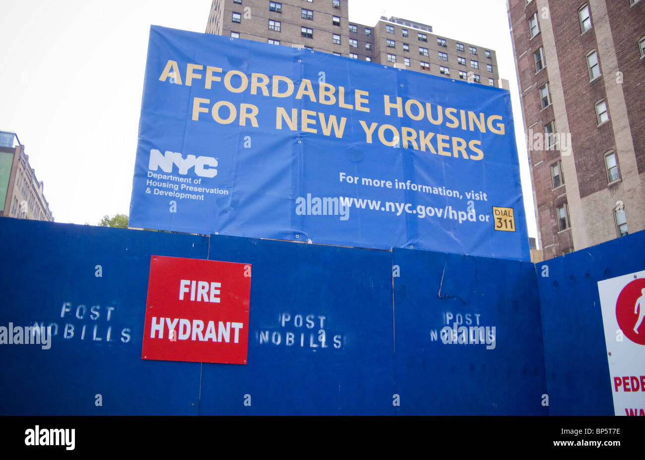 A sign announcing the construction of affordable housing is seen in the the New York neighborhood of Chelsea Stock Photo