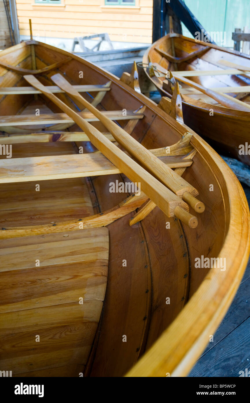 Traditionally built wooden rowing boat with oars at the marine museum in Norheimsund, Western Norway. Stock Photo