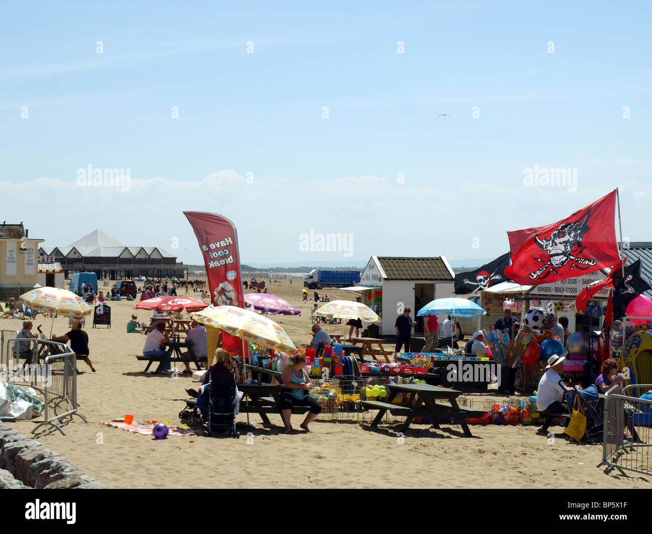 A busy beach and cafe on the beach at Weston-Super-Mare,Somerset,UK. Stock Photo