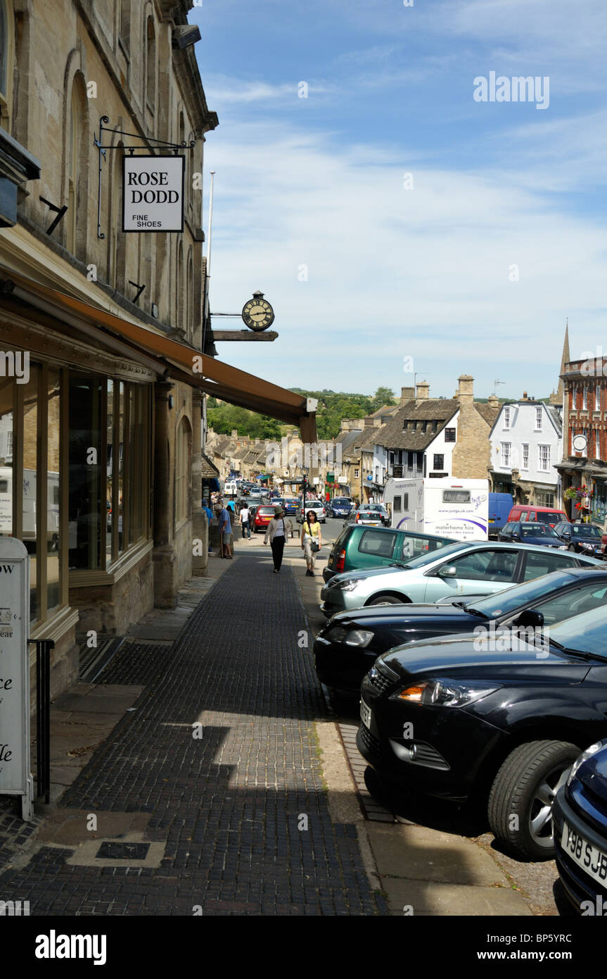 Pavement and roadside parking of Burford High Street, Cotswolds, UK. Stock Photo