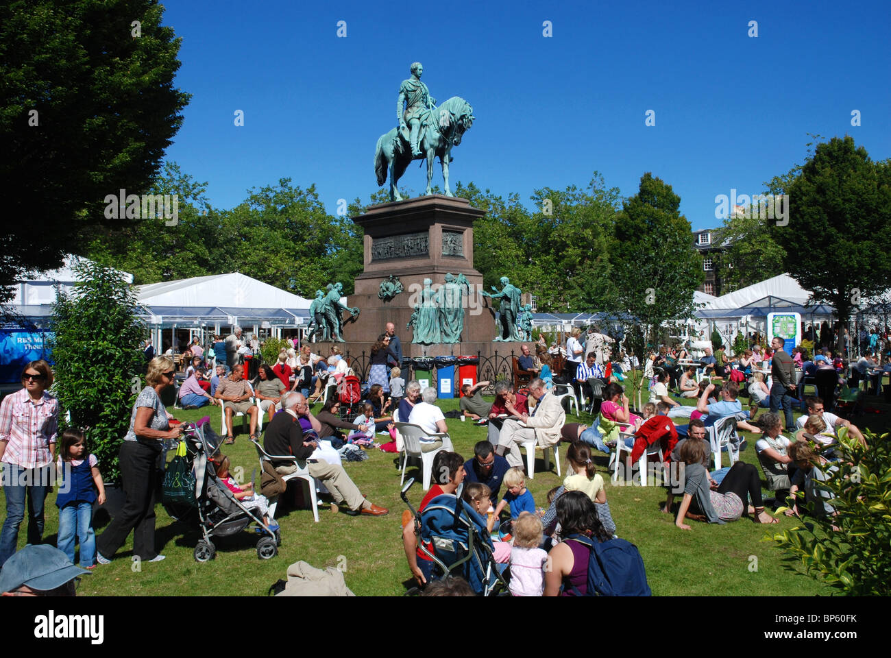 Visitors to the Edinburgh Book Festival enjoy the sunshine in Charlotte Square. Stock Photo