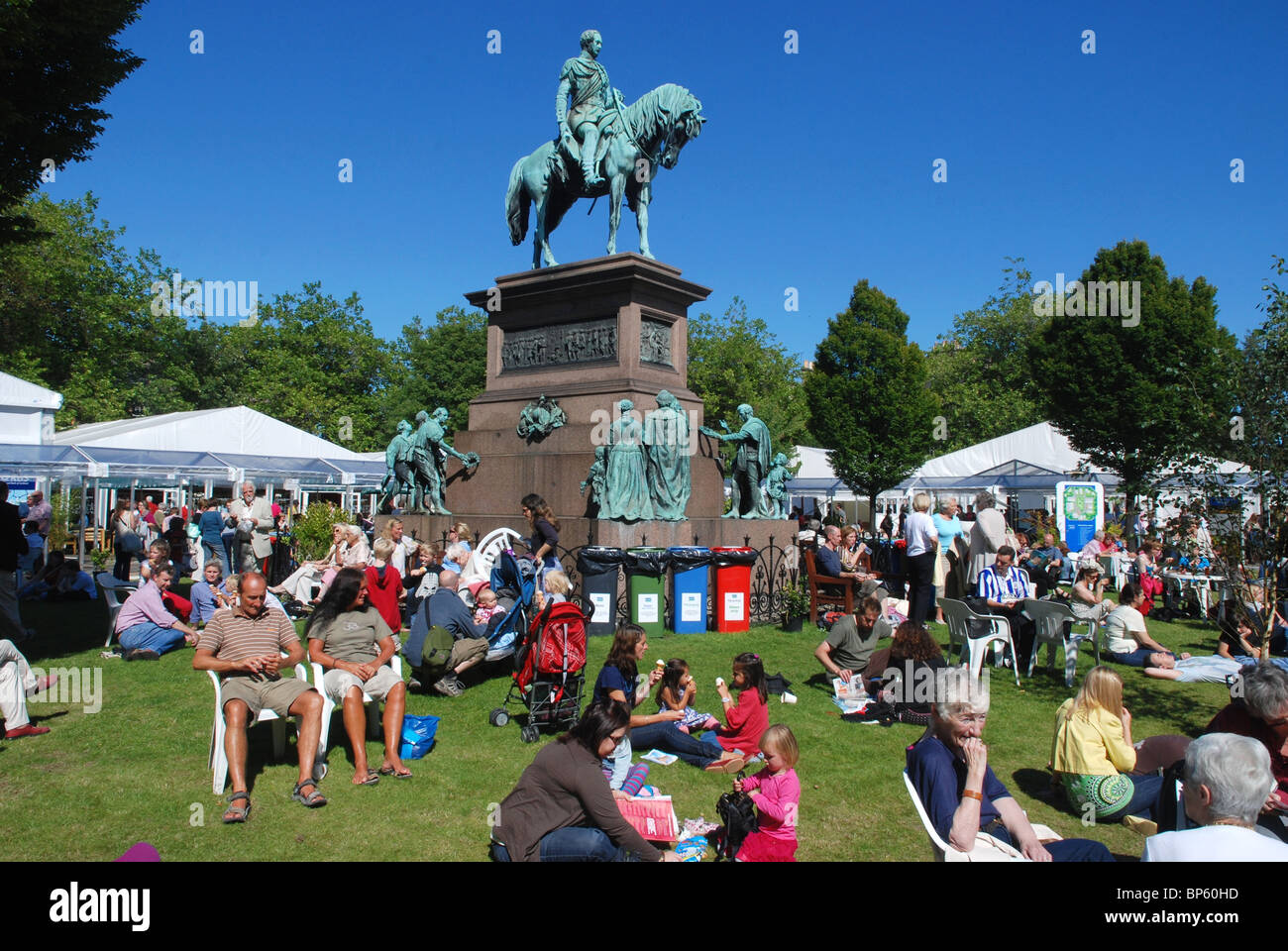 Visitors to the Edinburgh Book Festival enjoy the sunshine in Charlotte Square. Stock Photo