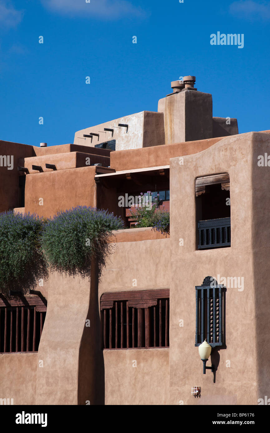 Building of pueblo revival style architecture with vigas and rounded corners in Santa Fe, New Mexico Stock Photo