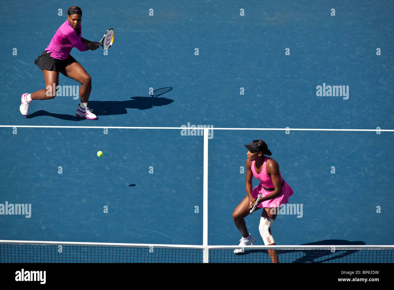 Venus and Serena Williams competing in the Women's Doubles Finals at the 2009 US Open Tennis Stock Photo