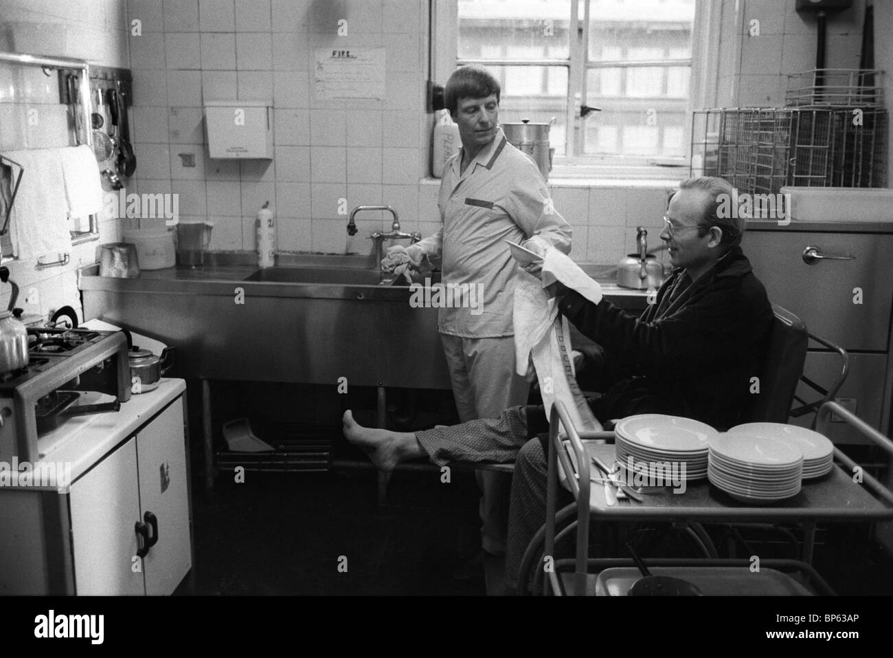 Winter of Discontent London 1979.  Westminster hospital patients who are able to work in their ward kitchens as staff strike. 1970s UK HOMER SYKES Stock Photo