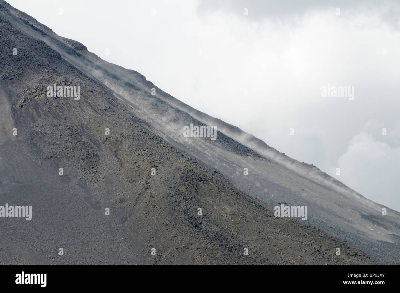 Pyroclastic bombs of ash, dust and gas roll down the cone of Arenal Volcano, La Fortuna, Costa Rica Stock Photo