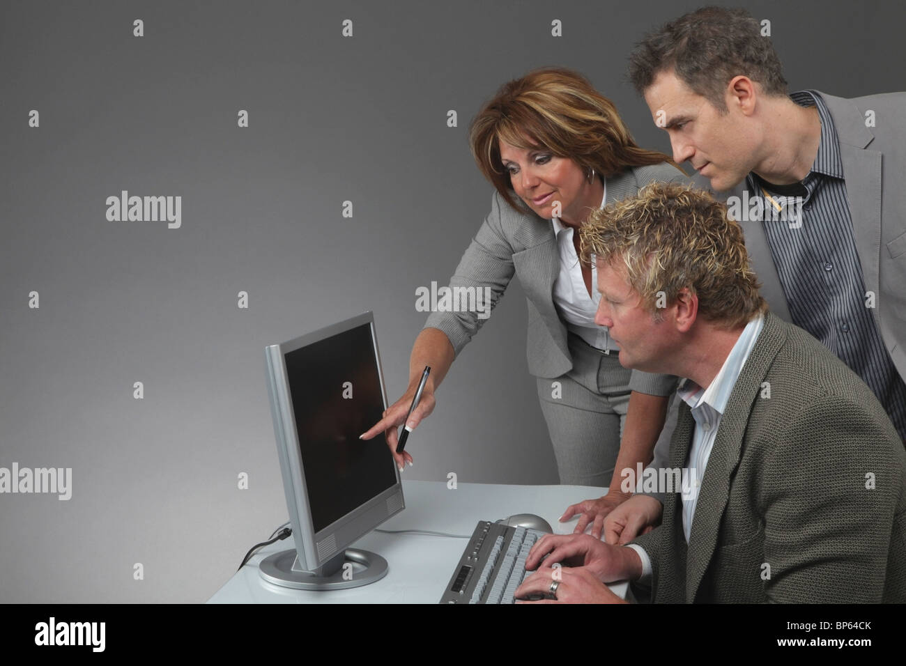 Jordan, Ontario, Canada; A Woman And Two Men Working At A Computer ...