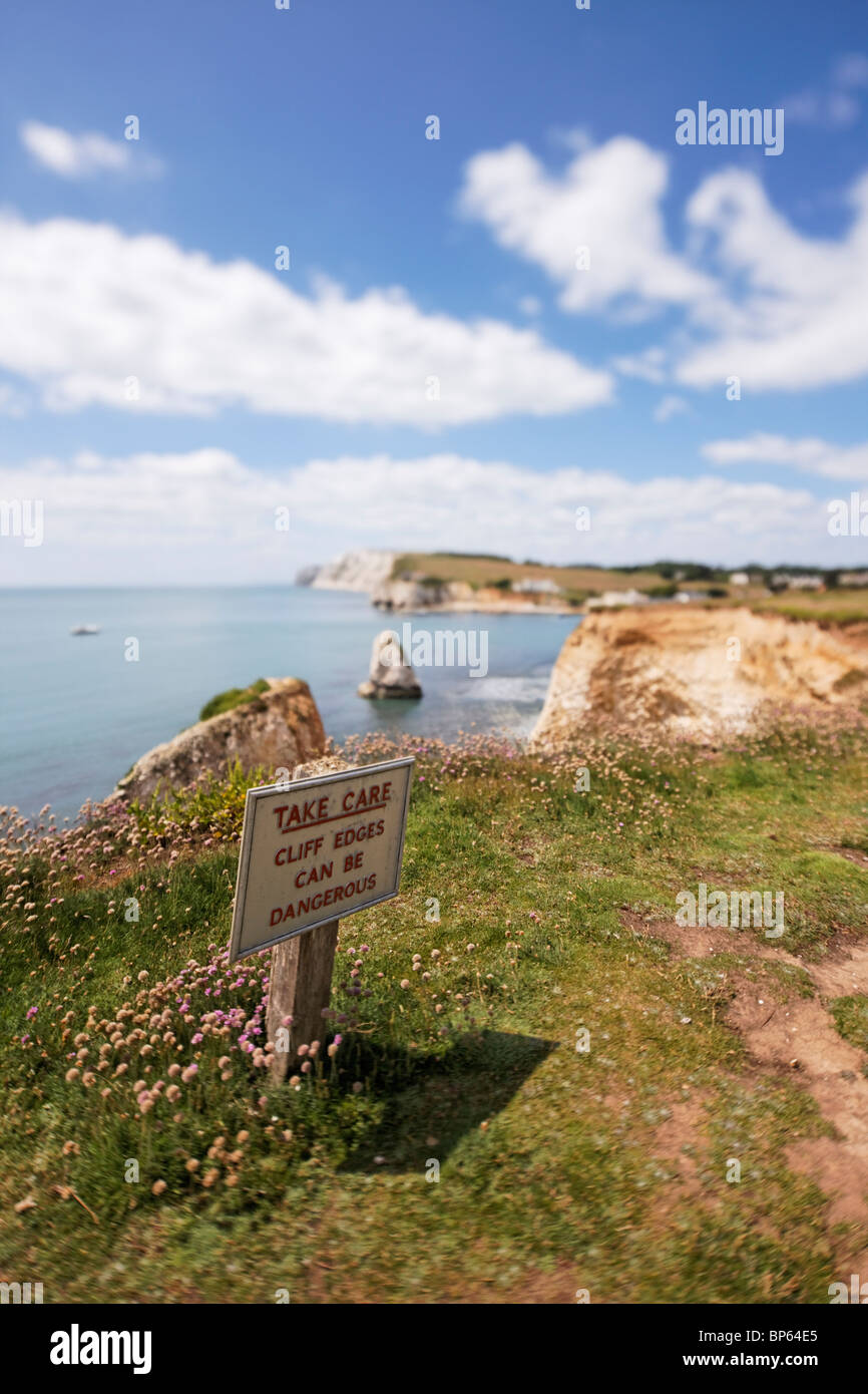 A view of Freshwater bay and 'Take Care' sign. Stock Photo