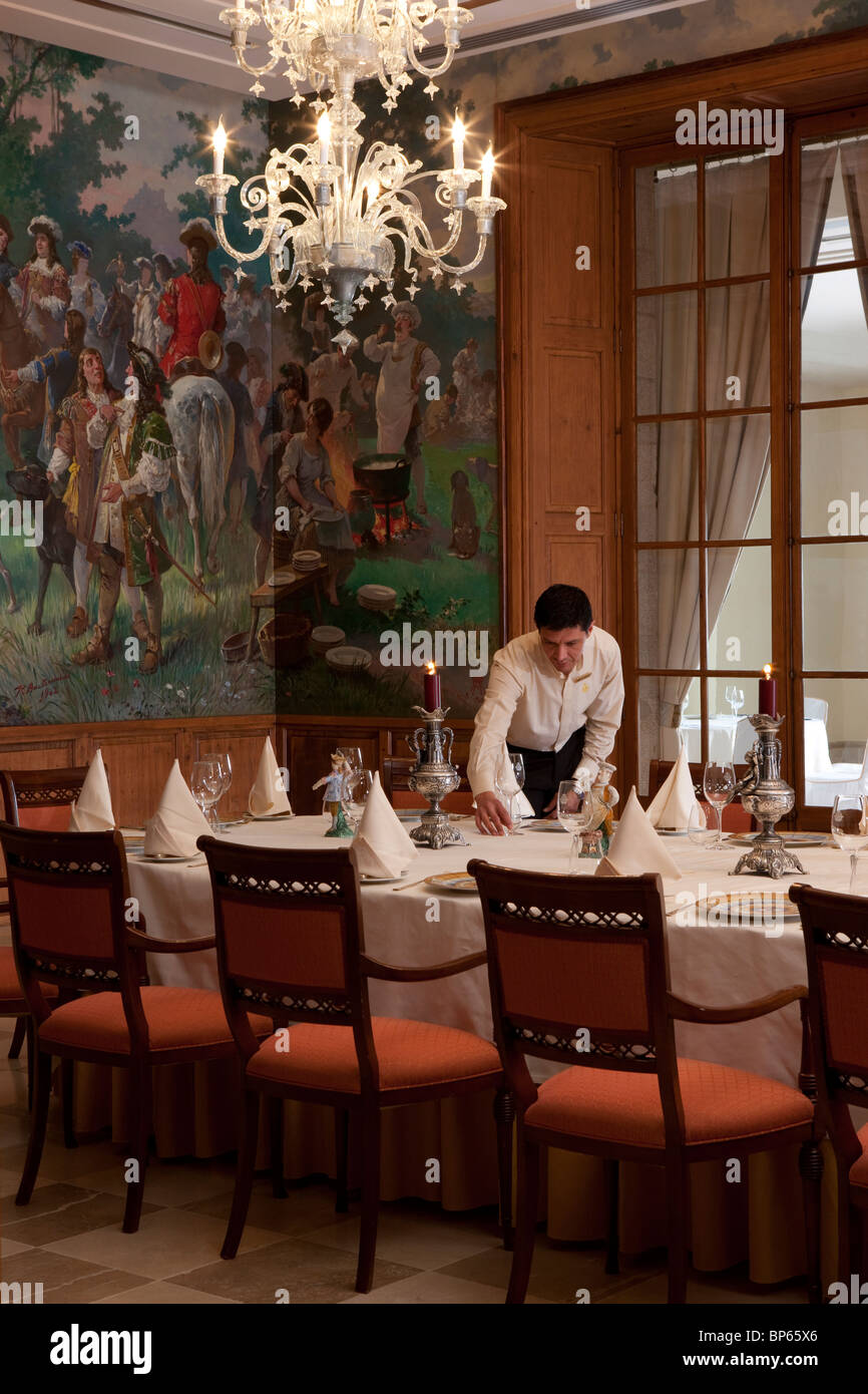 Waiter setting a banquet table Stock Photo