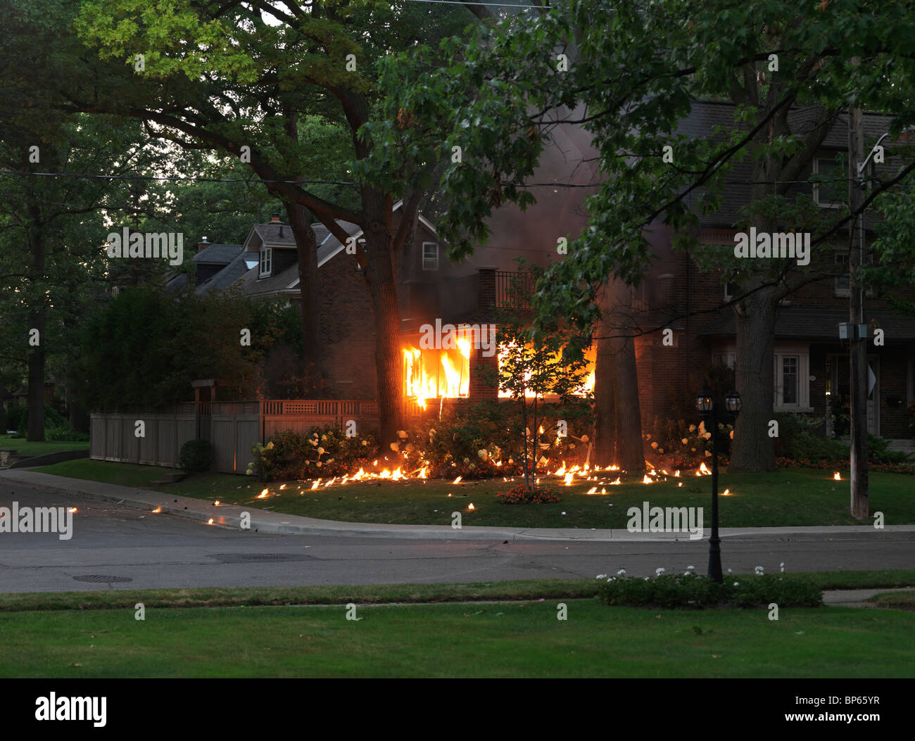 Residential house burning after an explosion Stock Photo