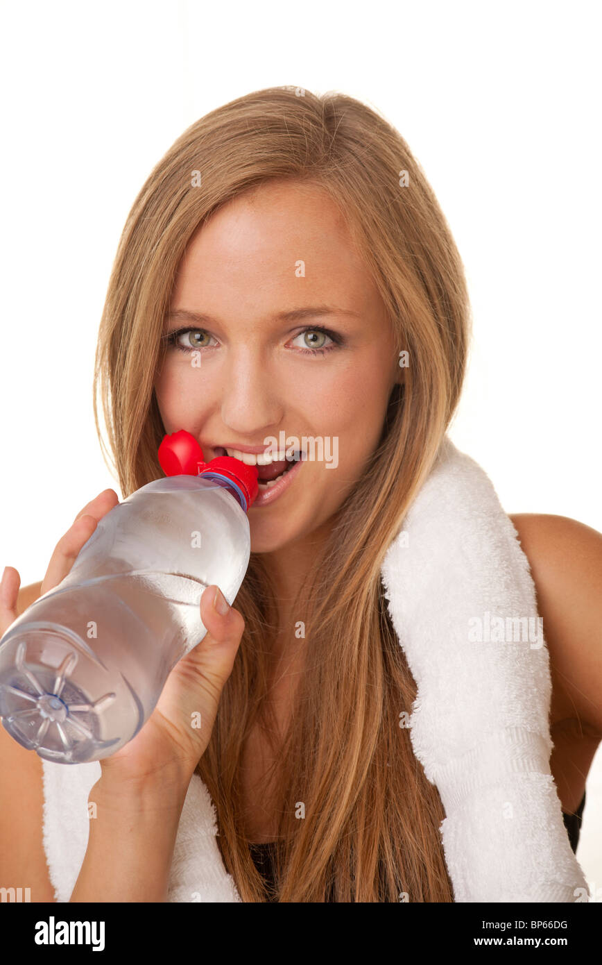 sporty woman drinking water from a bottle Stock Photo - Alamy