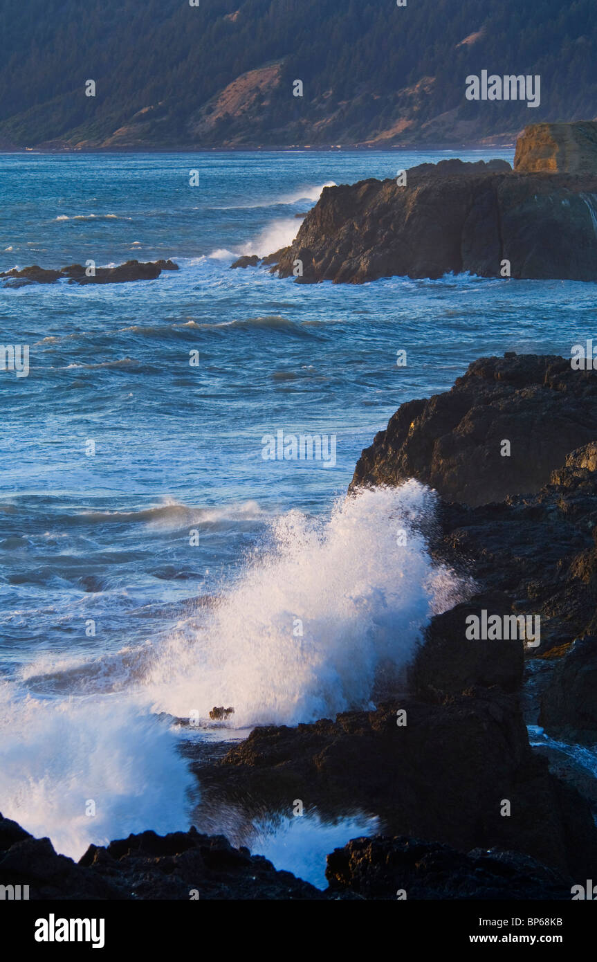 Waves crashing on coastal rock at sunset, Shelter Cove, on the rugged Lost Coast, Humboldt County, California Stock Photo